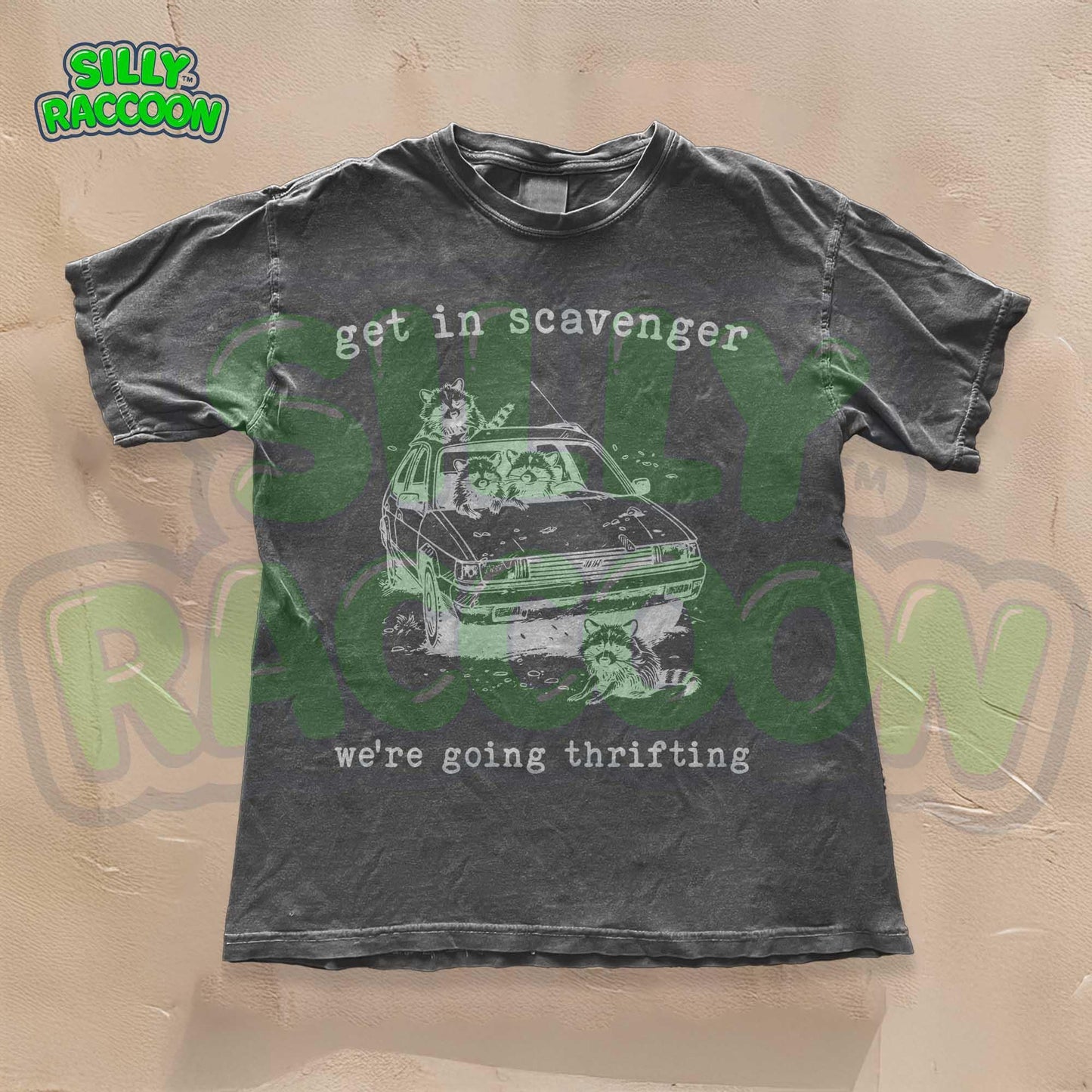 Get In Scavenger We're Going Thrifting" funny raccoon t-shirt for men and women. Vintage-style with a green graphic design of four silly raccoons in a station wagon. Perfect for thrifting lovers. Retro, humorous, unisex tee.
