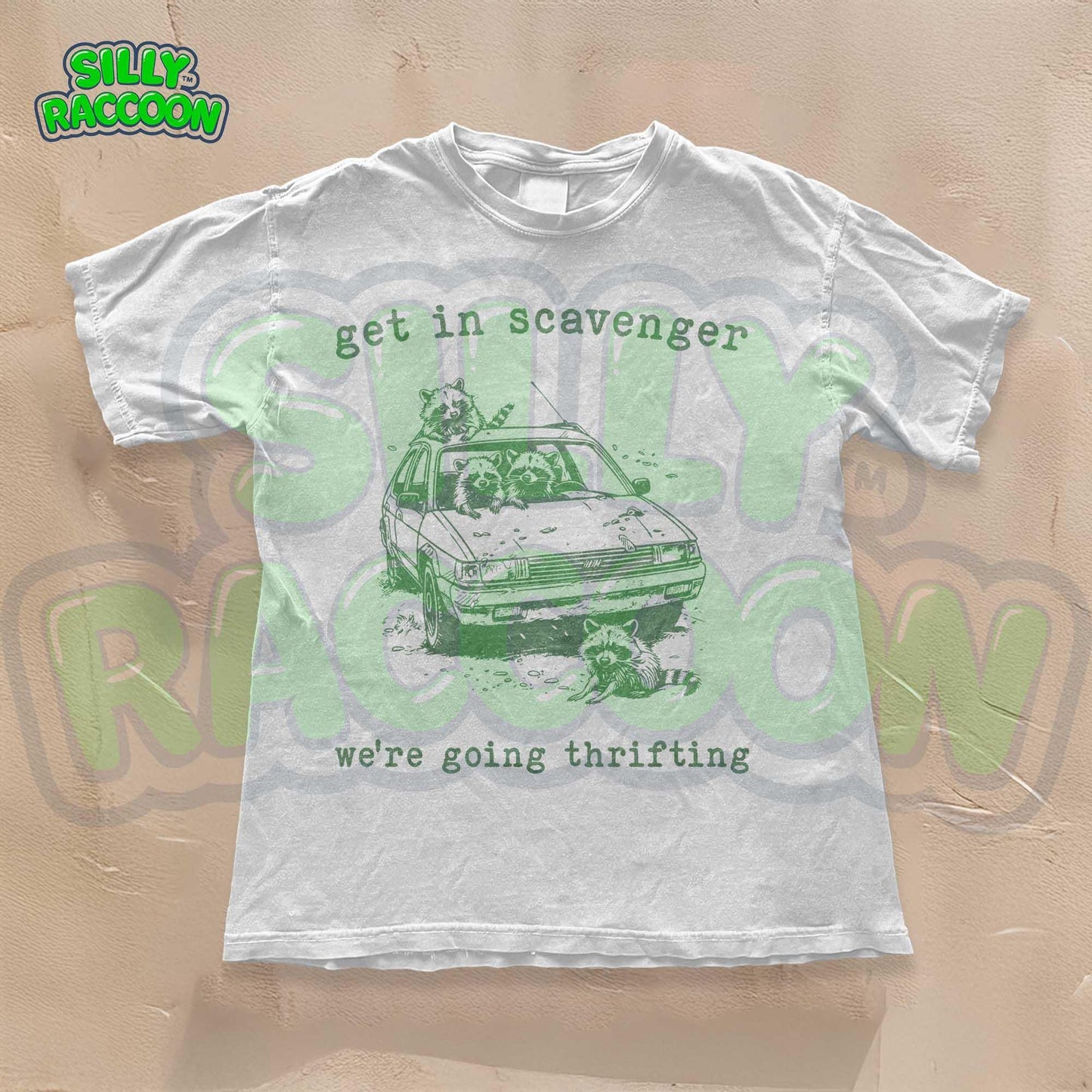 Get In Scavenger We're Going Thrifting" funny raccoon t-shirt for men and women. Vintage-style with a green graphic design of four silly raccoons in a station wagon. Perfect for thrifting lovers. Retro, humorous, unisex tee.