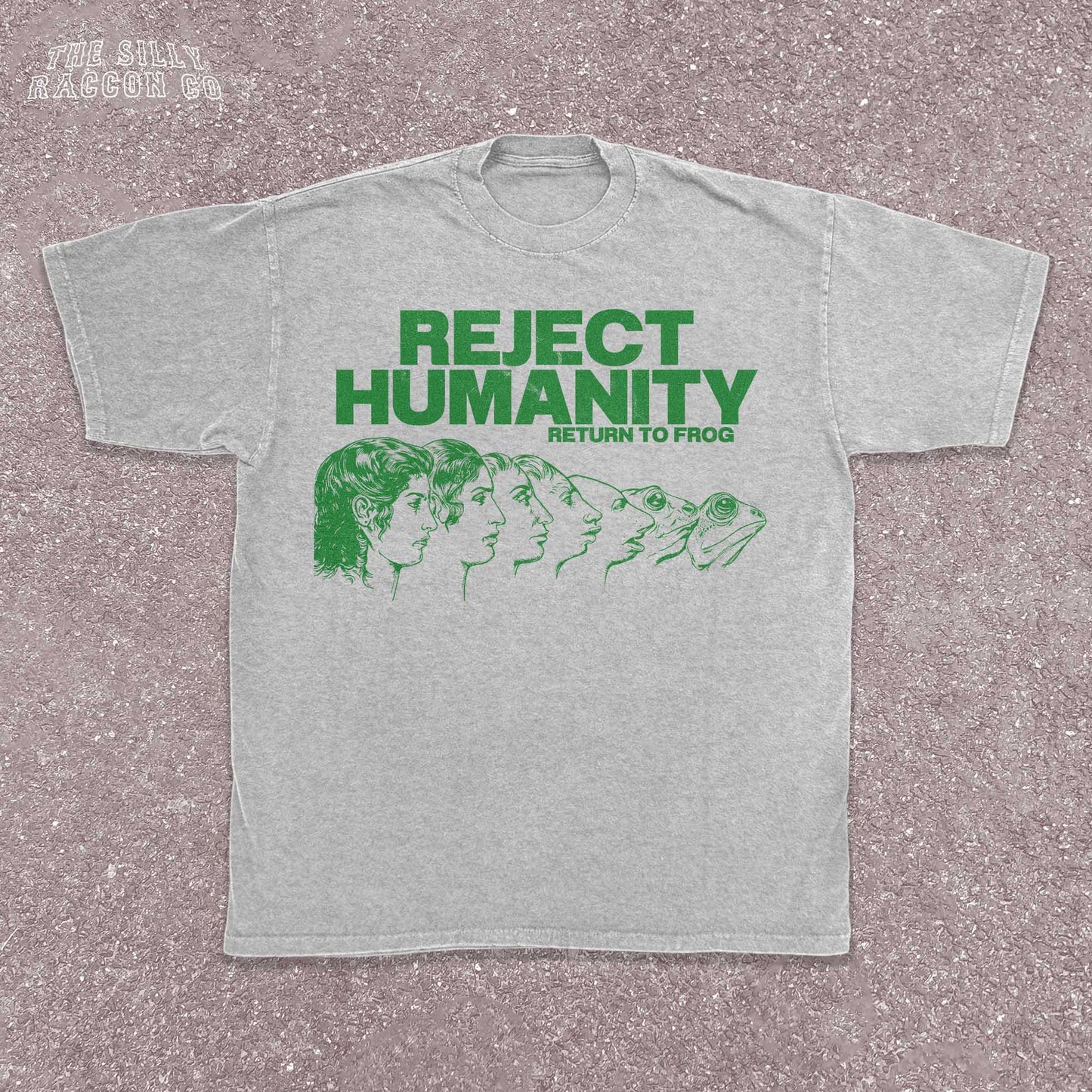 Unisex t-shirt for Gen Z featuring the text "Reject Humanity Return to Frog" in green with an illustrated human-to-frog evolution graphic. Perfect for fans of meme humor, absurdist internet culture, and ironic fashion. Retro Y2K style with soft fabric feel. Great gift idea for frog lovers, internet meme fans, or anyone into weird aesthetics and frogcore vibes.