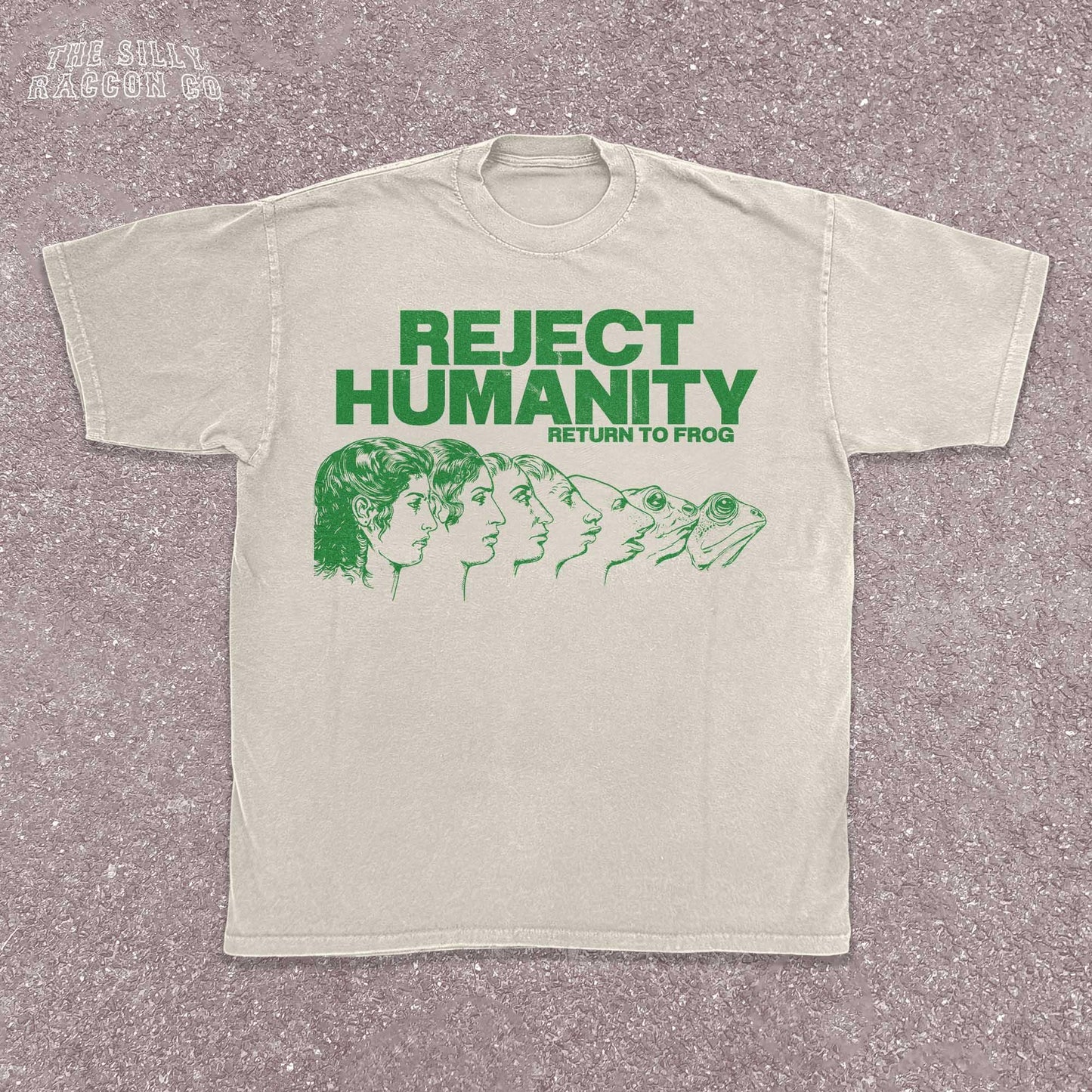 Unisex t-shirt for Gen Z featuring the text "Reject Humanity Return to Frog" in green with an illustrated human-to-frog evolution graphic. Perfect for fans of meme humor, absurdist internet culture, and ironic fashion. Retro Y2K style with soft fabric feel. Great gift idea for frog lovers, internet meme fans, or anyone into weird aesthetics and frogcore vibes.