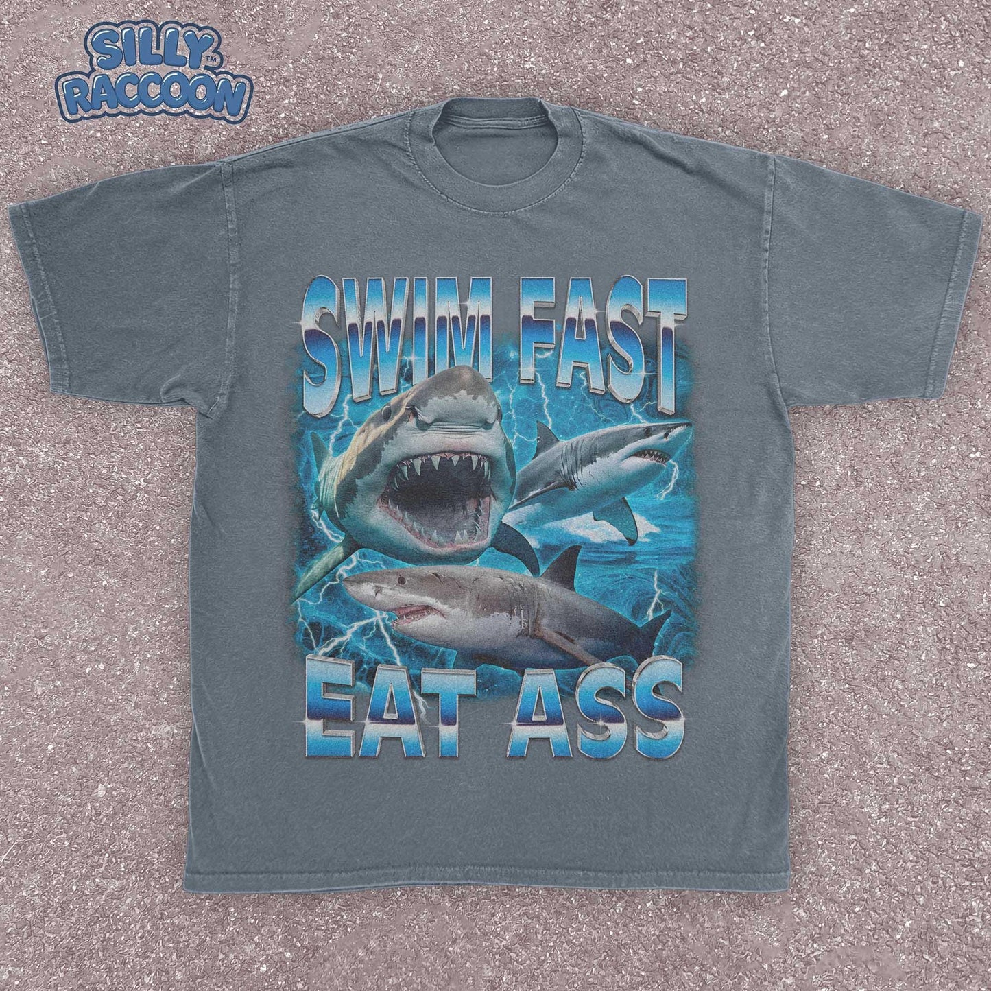 Funny adult humor graphic tee featuring three fierce sharks swimming aggressively with the edgy phrase "Swim Fast Eat Ass." Vibrant vintage-style design with bold blue letters and ocean wave graphics. Perfect meme culture shirt for young adults, shark lovers, sarcastic friends, or edgy trendsetters. Ideal casual tee for Shark Week, beach trips, parties, or humorous gifts. Provocative yet playful, this shirt makes a bold style statement.