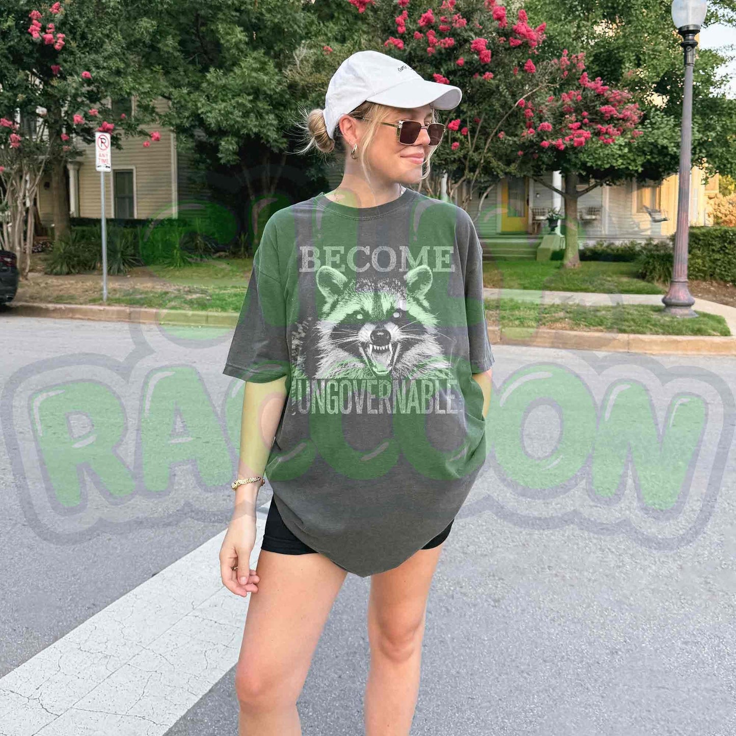 Vintage grunge dark grey t-shirt featuring an angry raccoon with the slogan Become Ungovernable. Perfect for fans of rebellious wildlife and sarcastic humor.