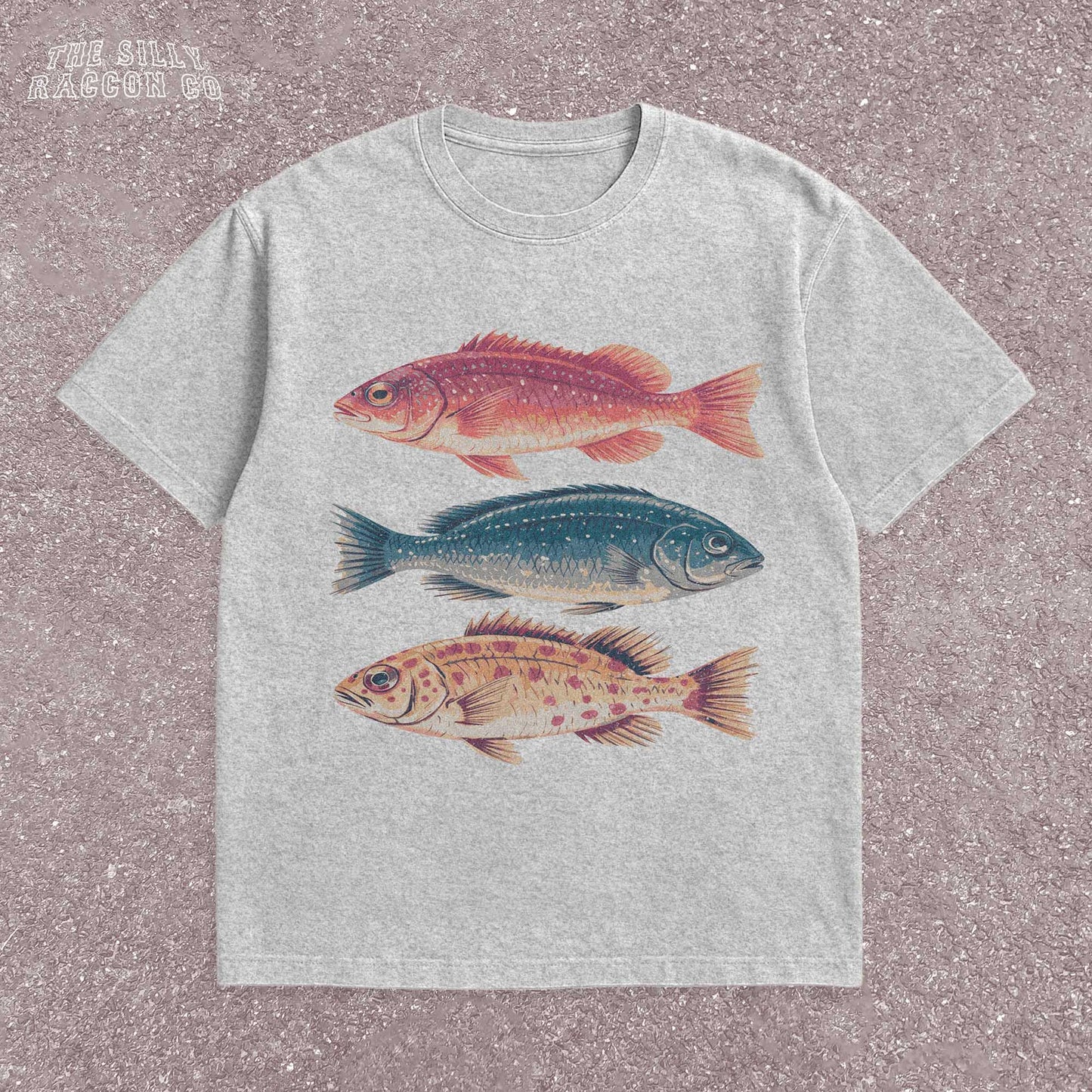 Vintage fish shirt for men and women featuring three illustrated fish in retro colors on a natural Comfort Colors tee. Perfect for outdoorsy types, ocean lovers, anglers, and marine biology fans. This nature-themed graphic t-shirt combines vintage style with beachy summer vibes. A great gift for fishermen, Father's Day, or anyone into fishing, sea life, or the outdoors. Classic fit with artistic nature illustrations.