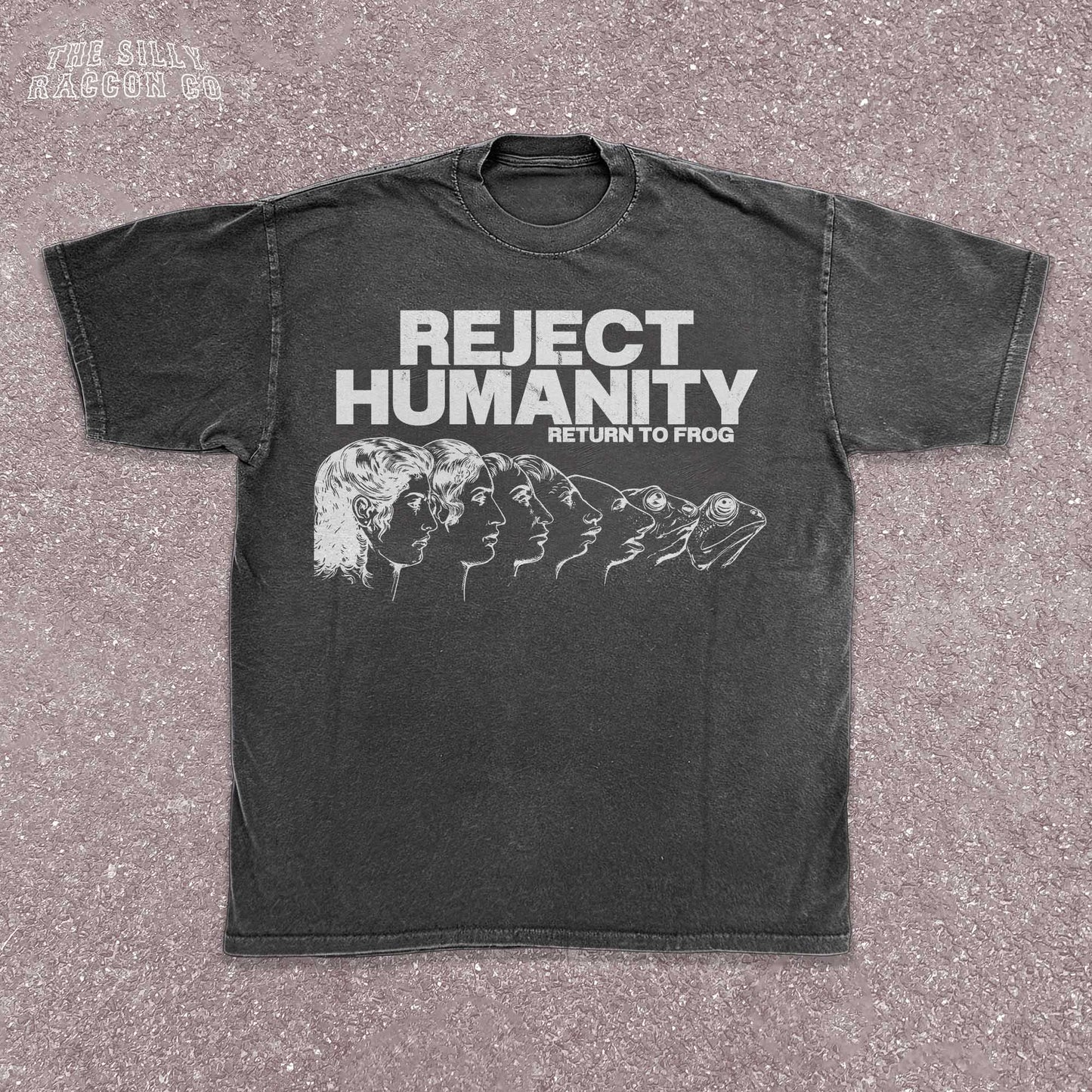 Unisex t-shirt for Gen Z featuring the text "Reject Humanity Return to Frog" in green with an illustrated human-to-frog evolution graphic. Perfect for fans of meme humor, absurdist internet culture, and ironic fashion. Retro Y2K style with soft fabric feel. Great gift idea for frog lovers, internet meme fans, or anyone into weird aesthetics and frogcore vibes.
