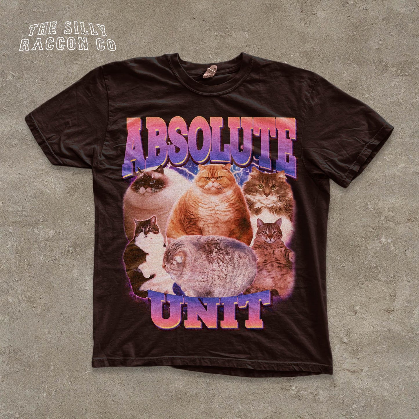 The image is a black t-shirt with a graphic design featuring a group of cats, including a large cat in the center surrounded by smaller cats.