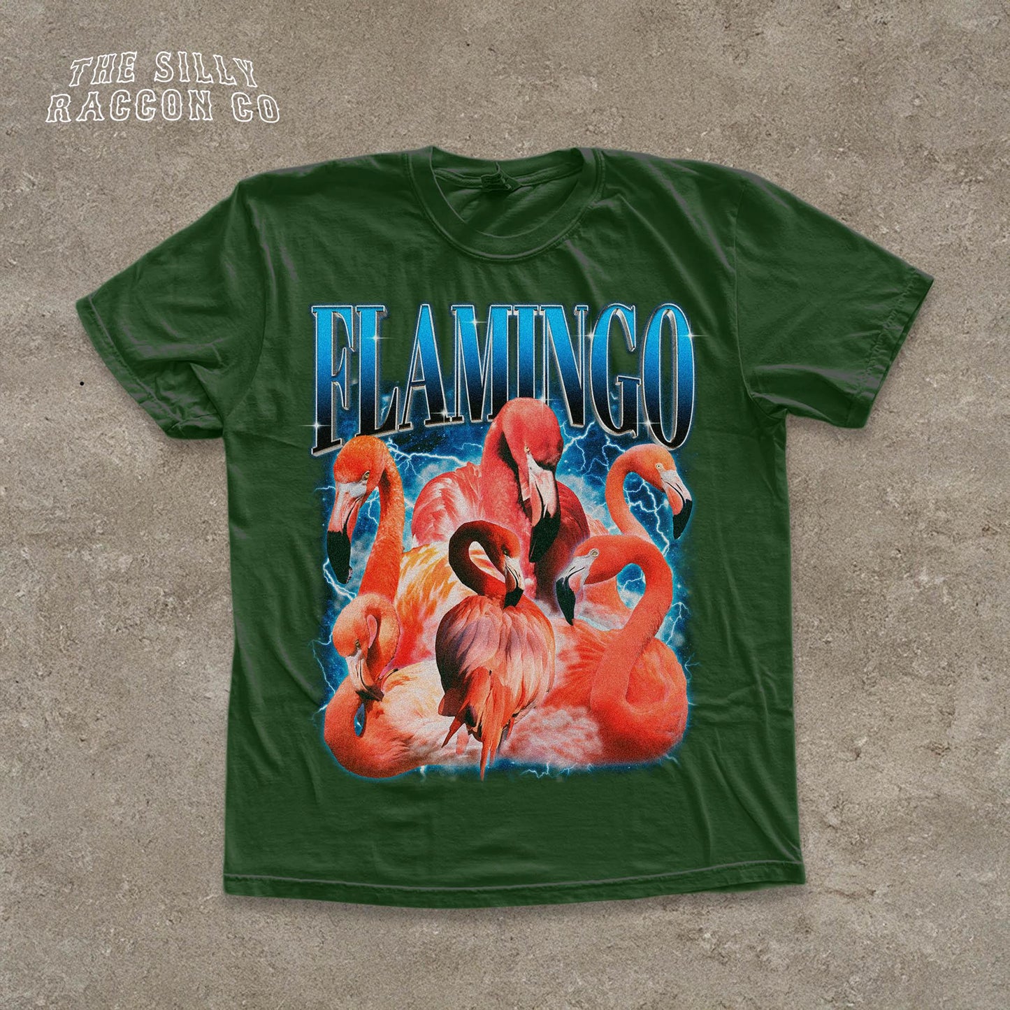 A green t-shirt with a graphic design featuring a group of flamingos.