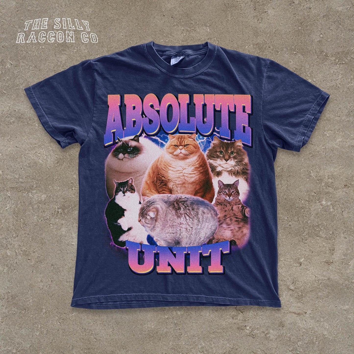 The image is a t-shirt design featuring a collage of various cat images, with the text "ABSOLUTE UNIT" prominently displayed.