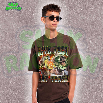 Funny raccoon graphic shirt for men and women featuring chaotic dumpster raccoons in a vintage meme collage style. Bold distressed text reads &quot;Live Fast Eat Trash&quot; over retro raccoons eating pizza and digging in garbage. Designed for meme lovers, unhinged humor fans, and raccoon-core enthusiasts. Perfect for birthdays, Gen Z humor gifts, or streetwear animal aesthetics. Makes a hilarious gift for trash panda lovers or quirky friends.