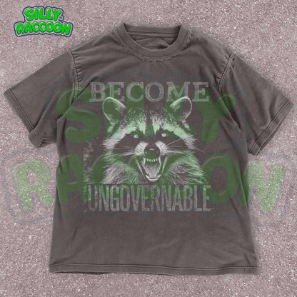 Vintage grunge dark grey t-shirt featuring an angry raccoon with the slogan Become Ungovernable. Perfect for fans of rebellious wildlife and sarcastic humor.