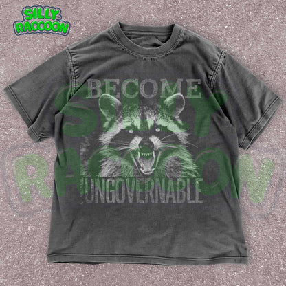 Vintage grunge dark grey t-shirt featuring an angry raccoon with the slogan Become Ungovernable. Perfect for fans of rebellious wildlife and sarcastic humor.