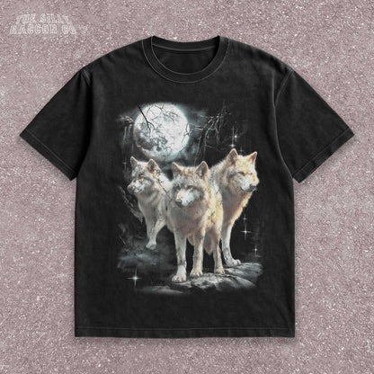Vintage washed black graphic T-shirt for men, women, and unisex, featuring three realistic wolves standing proudly under a glowing full moon in a mystical forest setting. Retro style reminiscent of 90s nostalgia, perfect for animal lovers and humorously ironic aesthetics. Ideal funny gift for men, dads, brothers, or friends who appreciate spirit animal themes and quirky fashion. Soft, comfy fit makes this tee a standout piece for everyday casual wear or special occasions.