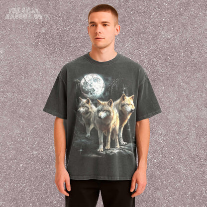 Vintage washed black graphic T-shirt for men, women, and unisex, featuring three realistic wolves standing proudly under a glowing full moon in a mystical forest setting. Retro style reminiscent of 90s nostalgia, perfect for animal lovers and humorously ironic aesthetics. Ideal funny gift for men, dads, brothers, or friends who appreciate spirit animal themes and quirky fashion. Soft, comfy fit makes this tee a standout piece for everyday casual wear or special occasions.