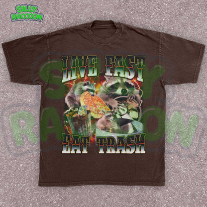 Funny raccoon graphic shirt for men and women featuring chaotic dumpster raccoons in a vintage meme collage style. Bold distressed text reads &quot;Live Fast Eat Trash&quot; over retro raccoons eating pizza and digging in garbage. Designed for meme lovers, unhinged humor fans, and raccoon-core enthusiasts. Perfect for birthdays, Gen Z humor gifts, or streetwear animal aesthetics. Makes a hilarious gift for trash panda lovers or quirky friends.