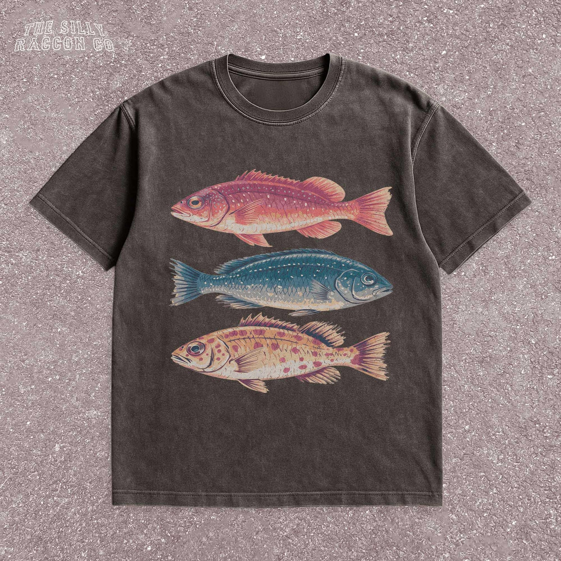 Vintage fish shirt for men and women featuring three illustrated fish in retro colors on a natural Comfort Colors tee. Perfect for outdoorsy types, ocean lovers, anglers, and marine biology fans. This nature-themed graphic t-shirt combines vintage style with beachy summer vibes. A great gift for fishermen, Father&#39;s Day, or anyone into fishing, sea life, or the outdoors. Classic fit with artistic nature illustrations.
