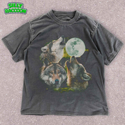 Three Wolf Moon T-Shirt for nature lovers. Mystical wolf pack design with wolves howling at full moon. Perfect for wildlife and spiritual enthusiasts. Unisex fit in charcoal grey.