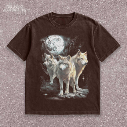 Vintage washed black graphic T-shirt for men, women, and unisex, featuring three realistic wolves standing proudly under a glowing full moon in a mystical forest setting. Retro style reminiscent of 90s nostalgia, perfect for animal lovers and humorously ironic aesthetics. Ideal funny gift for men, dads, brothers, or friends who appreciate spirit animal themes and quirky fashion. Soft, comfy fit makes this tee a standout piece for everyday casual wear or special occasions.