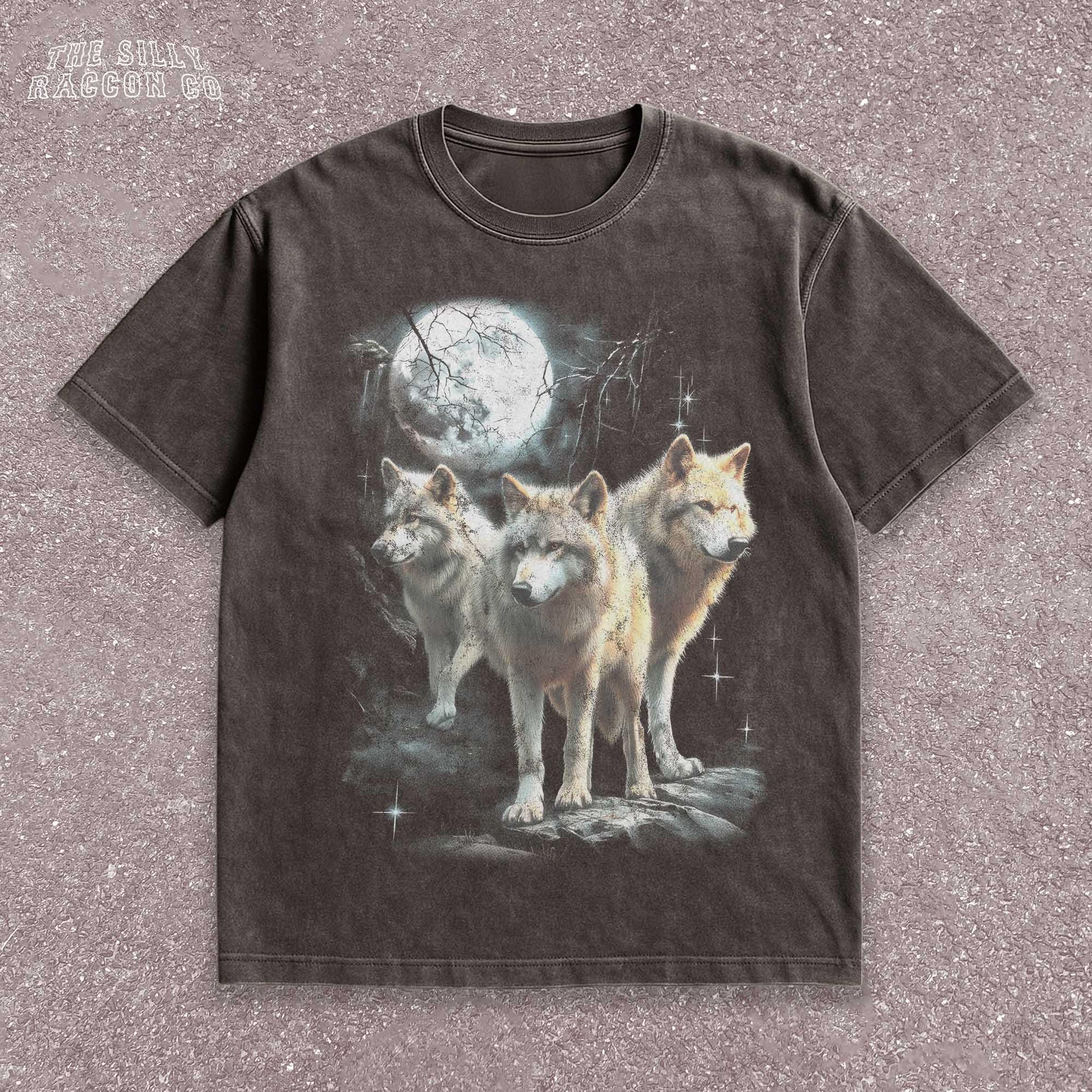 Vintage washed black graphic T-shirt for men, women, and unisex, featuring three realistic wolves standing proudly under a glowing full moon in a mystical forest setting. Retro style reminiscent of 90s nostalgia, perfect for animal lovers and humorously ironic aesthetics. Ideal funny gift for men, dads, brothers, or friends who appreciate spirit animal themes and quirky fashion. Soft, comfy fit makes this tee a standout piece for everyday casual wear or special occasions.