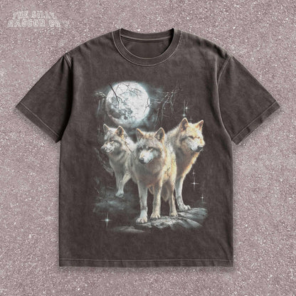 Vintage washed black graphic T-shirt for men, women, and unisex, featuring three realistic wolves standing proudly under a glowing full moon in a mystical forest setting. Retro style reminiscent of 90s nostalgia, perfect for animal lovers and humorously ironic aesthetics. Ideal funny gift for men, dads, brothers, or friends who appreciate spirit animal themes and quirky fashion. Soft, comfy fit makes this tee a standout piece for everyday casual wear or special occasions.